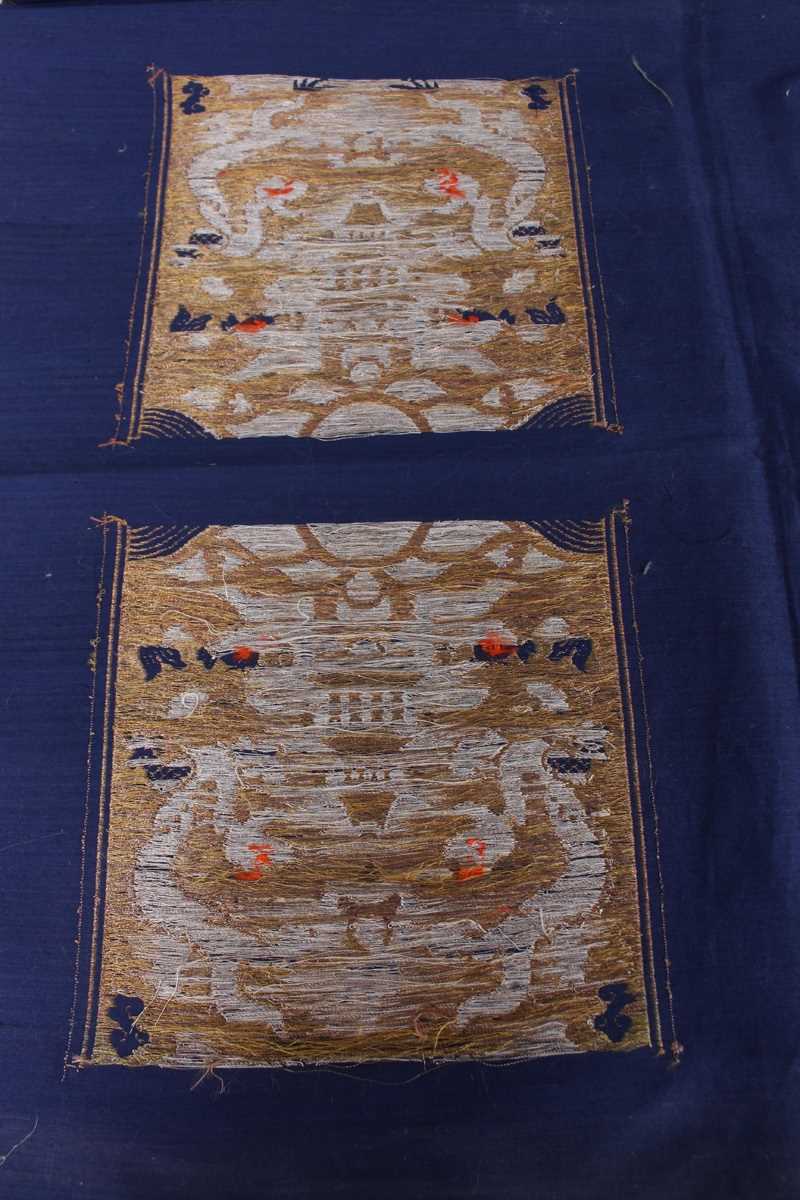 A Chinese blue silk embroidered rectangular panel, 20th century, worked with eight matching rank - Image 34 of 70