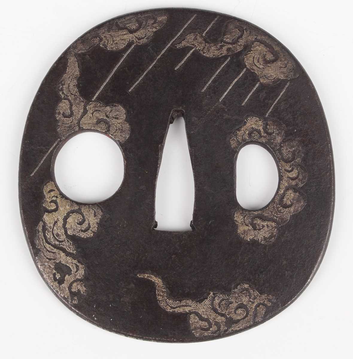 A Japanese cast iron oval tsuba, Edo period, with silver damascened dragon and vapour decoration, - Image 5 of 9