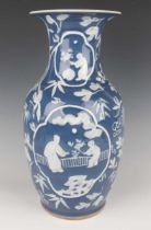 A Chinese white enamelled and blue glazed porcelain vase, late 19th century, of shouldered