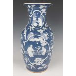 A Chinese white enamelled and blue glazed porcelain vase, late 19th century, of shouldered