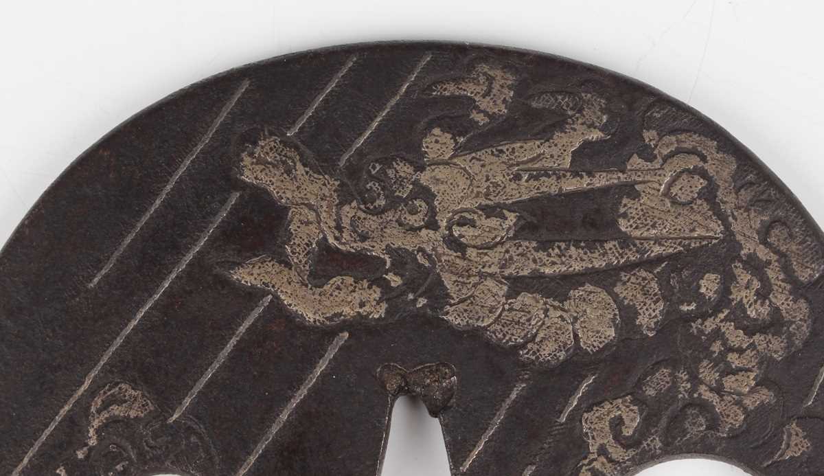 A Japanese cast iron oval tsuba, Edo period, with silver damascened dragon and vapour decoration, - Image 2 of 9