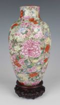 A Chinese famille rose enamelled millefleurs porcelain vase, mark of Qianlong but Republic period,