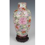 A Chinese famille rose enamelled millefleurs porcelain vase, mark of Qianlong but Republic period,
