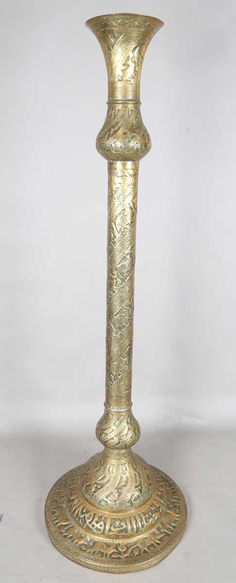 An Islamic brass floor lamp, circa 1900, the flared surmount and cylindrical column decorated with - Image 9 of 24