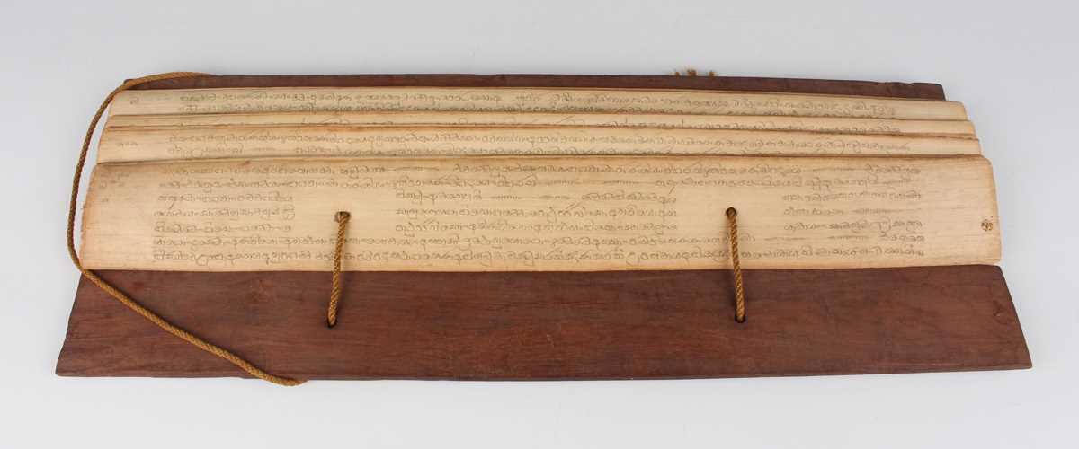 A Burmese palm leaf manuscript, late 19th century, comprising twenty-nine leaves of Sanskrit script, - Image 2 of 16