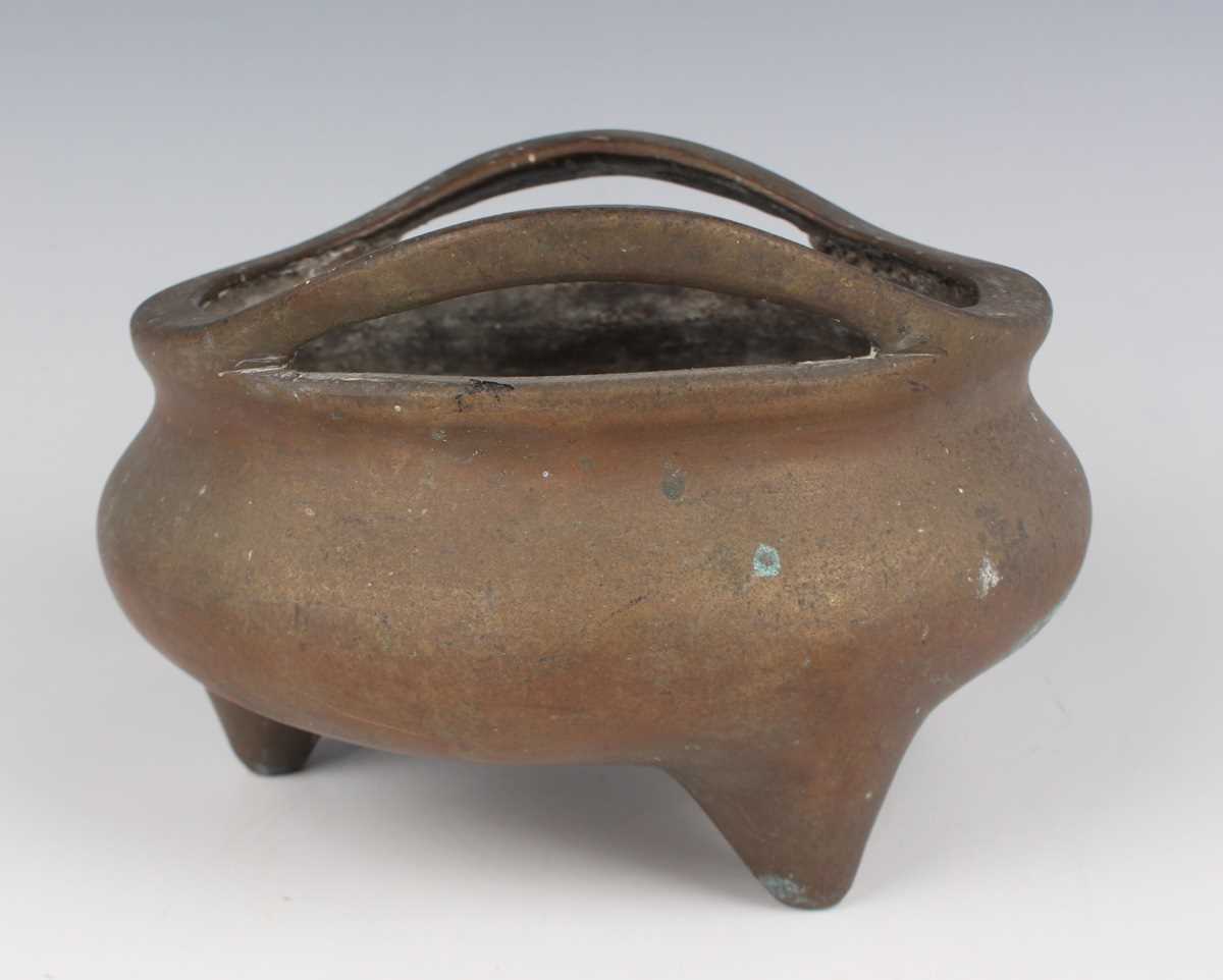 A Chinese bronze bombé censer, 19th/20th century, of low-bellied circular form with a pair of loop - Image 4 of 7