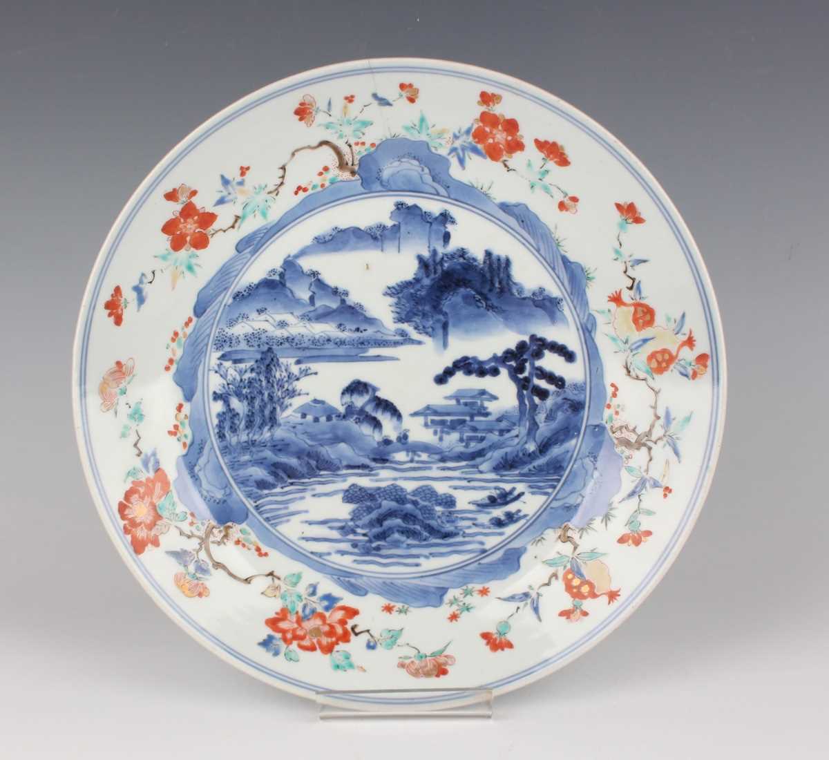 A Japanese Kakiemon porcelain circular dish, Edo period, circa 1700, the centre painted in