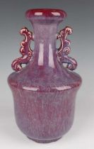 A Chinese flambé glazed porcelain vase, probably 20th century, of baluster form with flared narrow