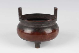 A Chinese brown patinated bronze tripod censer, mark of Qianlong but later, of low-bellied