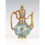 A Chinese cloisonné enamel and gilt copper ewer, mark and period of Qianlong, the pear-form body