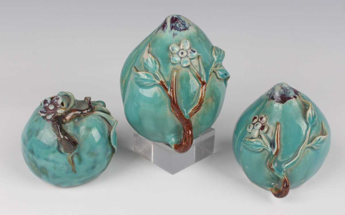 A group of three Chinese pottery water dropper models of peaches, 20th century, each