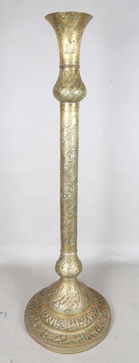 An Islamic brass floor lamp, circa 1900, the flared surmount and cylindrical column decorated with - Image 14 of 24