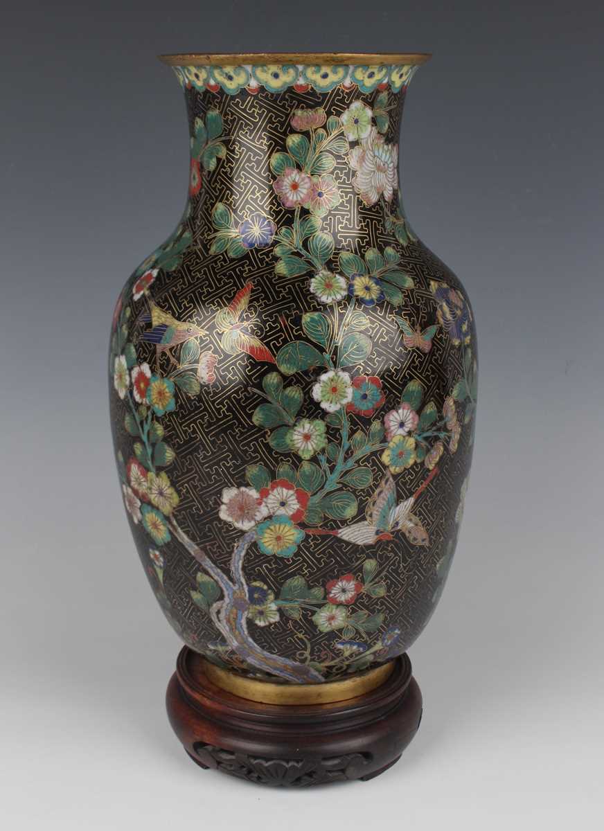 A Chinese cloisonné vase, late Qing dynasty, of swollen cylindrical form with flared neck, decorated