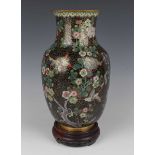 A Chinese cloisonné vase, late Qing dynasty, of swollen cylindrical form with flared neck, decorated
