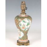 A Chinese famille verte porcelain gilt metal mounted meiping, late 19th century, the baluster body