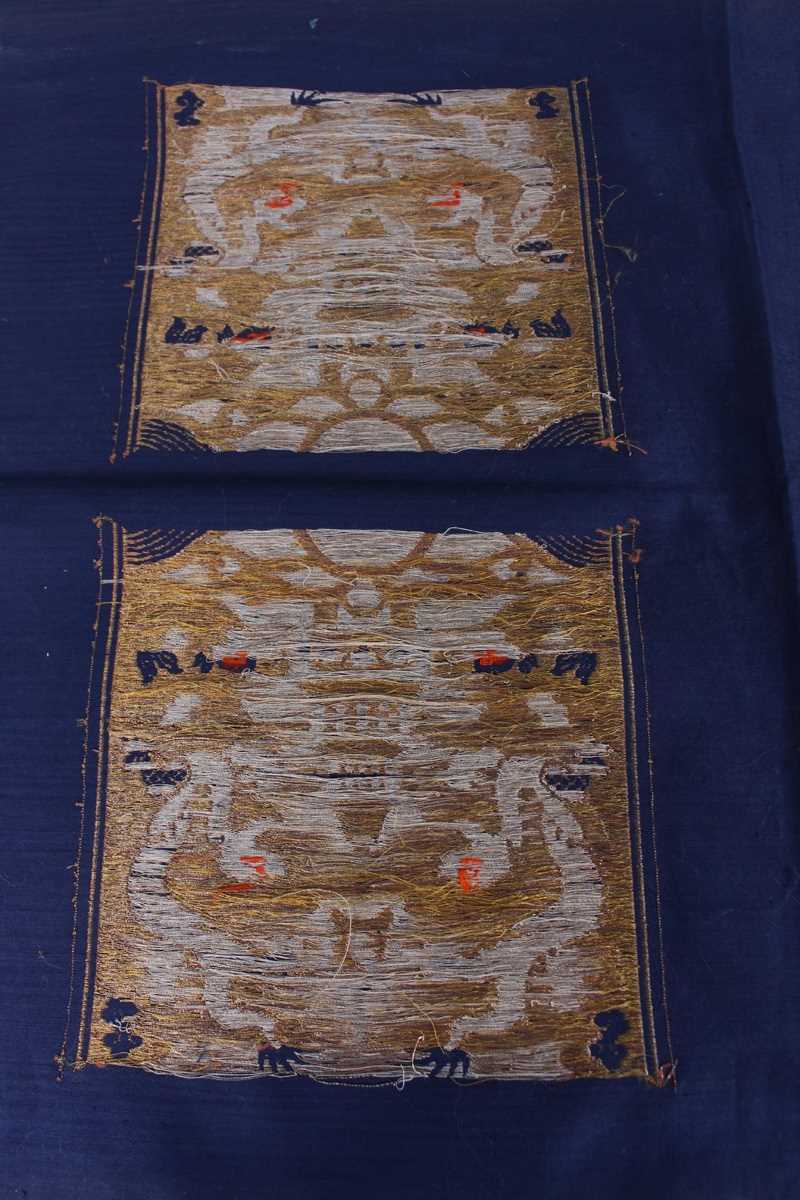 A Chinese blue silk embroidered rectangular panel, 20th century, worked with eight matching rank - Image 32 of 70