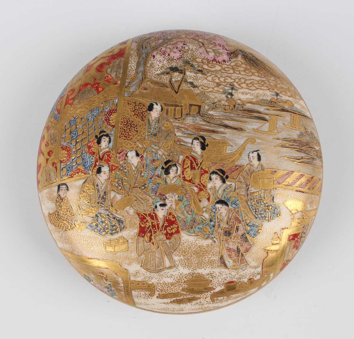 A Japanese Satsuma earthenware kogo box and cover, Meiji period, of flattened circular form, the top