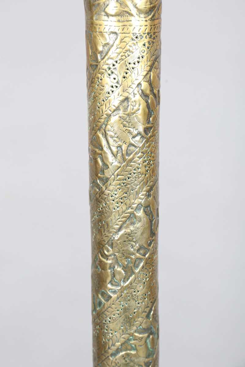 An Islamic brass floor lamp, circa 1900, the flared surmount and cylindrical column decorated with - Image 11 of 24