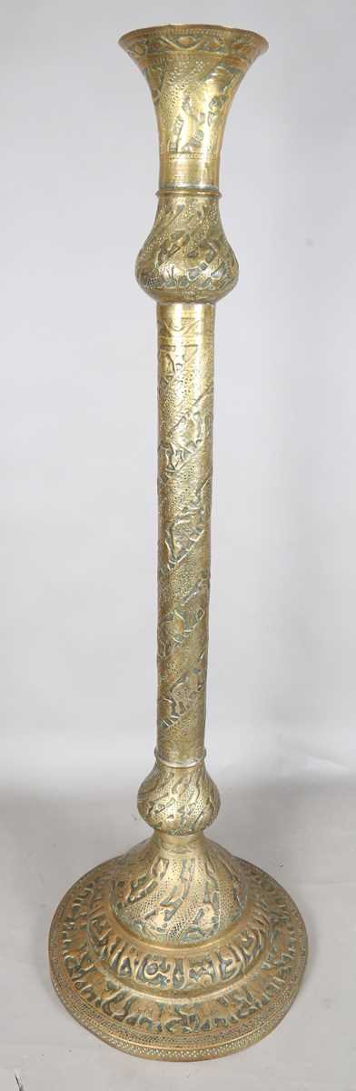 An Islamic brass floor lamp, circa 1900, the flared surmount and cylindrical column decorated with - Image 19 of 24