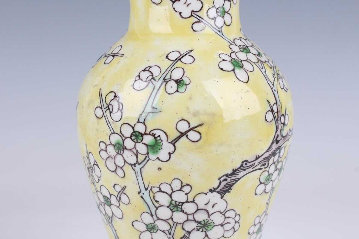 A pair of Chinese yellow ground porcelain vases, late Qing dynasty, of baluster form, decorated with - Image 16 of 33
