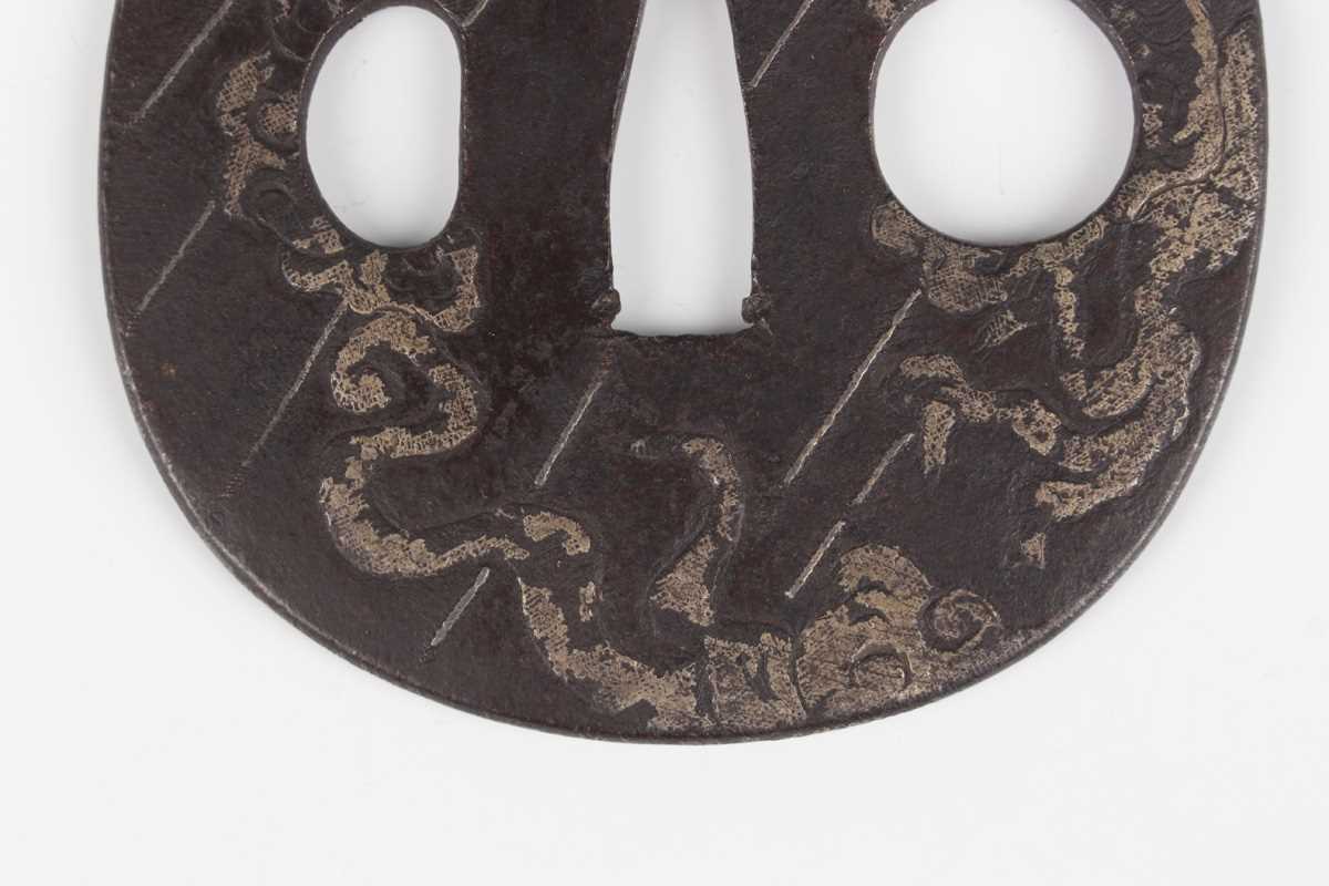 A Japanese cast iron oval tsuba, Edo period, with silver damascened dragon and vapour decoration, - Image 4 of 9