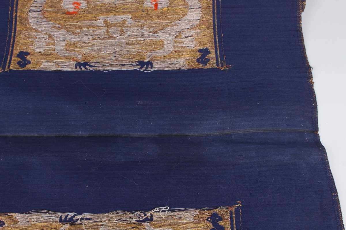 A Chinese blue silk embroidered rectangular panel, 20th century, worked with eight matching rank - Image 36 of 70