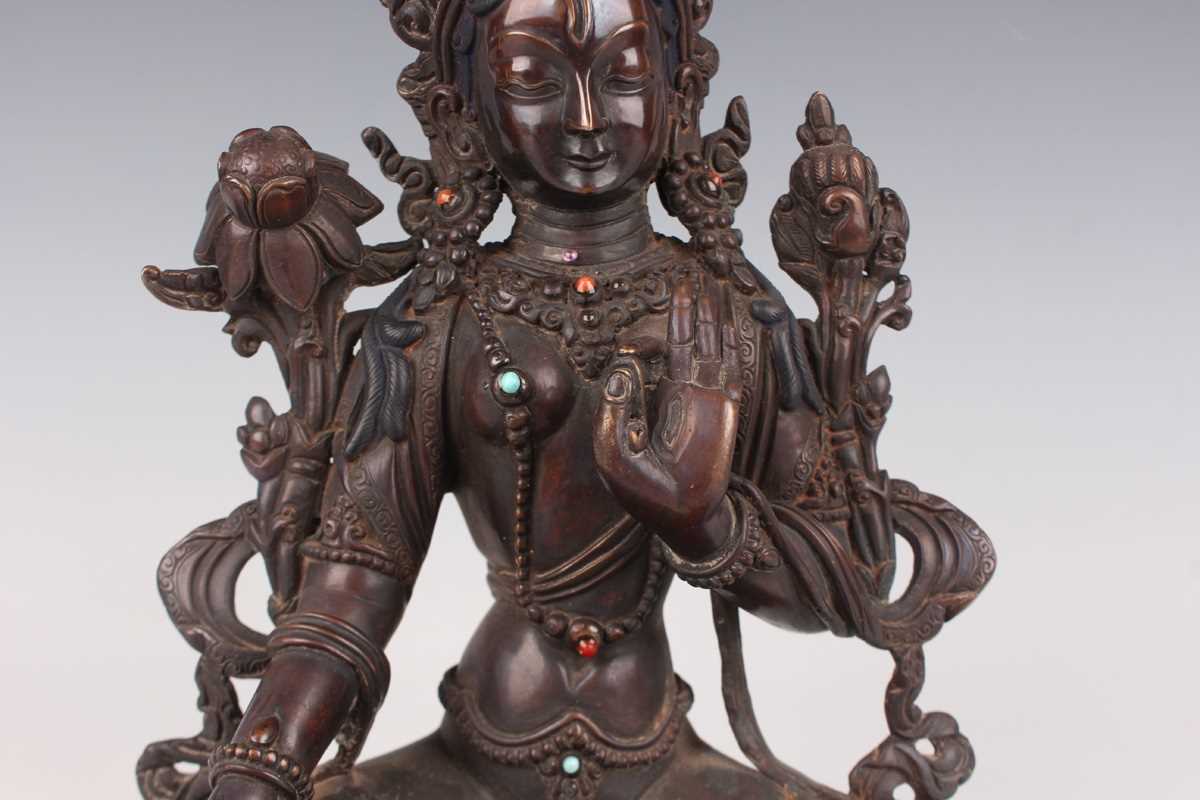 A Sino-Tibetan brown patinated copper alloy figure of Tara, 20th century, modelled seated in - Image 3 of 9