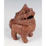 A Chinese iron red oxide washed stoneware Buddhistic lion censer, 20th century, modelled standing