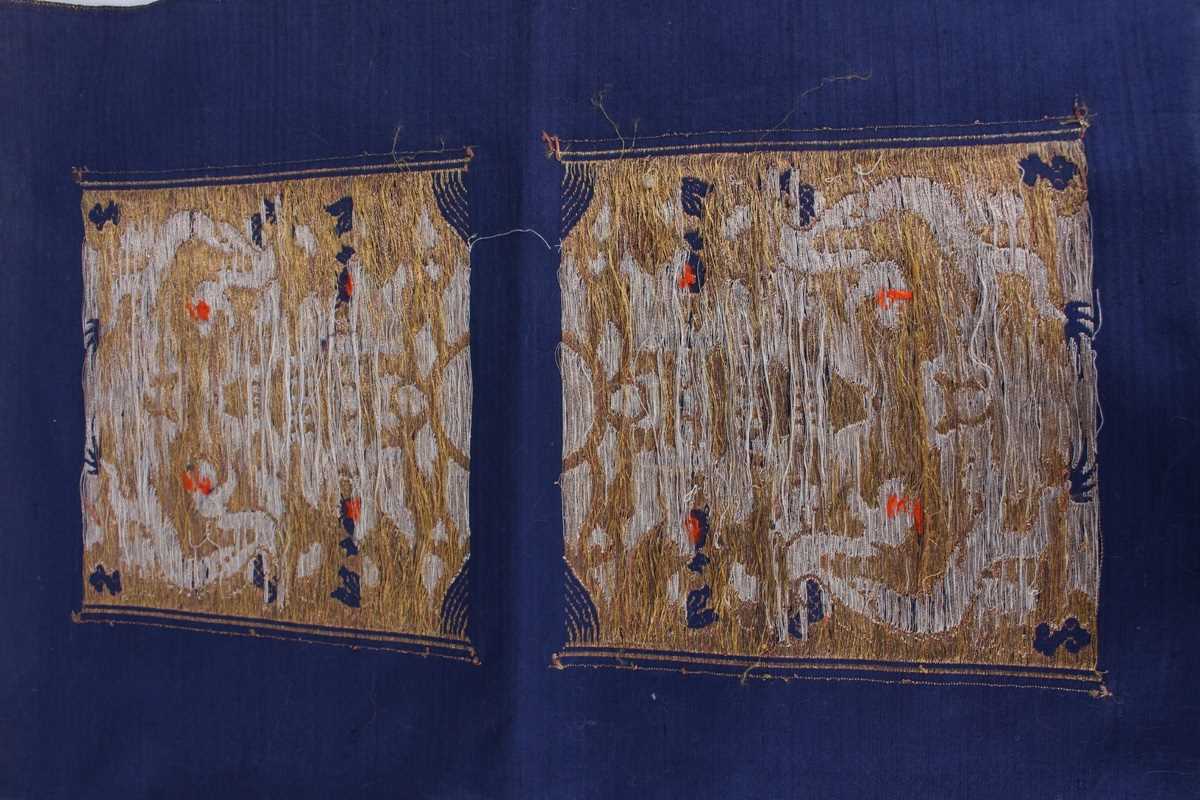 A Chinese blue silk embroidered rectangular panel, 20th century, worked with eight matching rank - Image 31 of 70