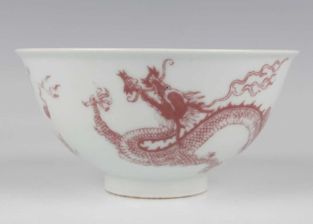 A Chinese underglaze red decorated porcelain bowl of steep-sided circular form, the exterior painted