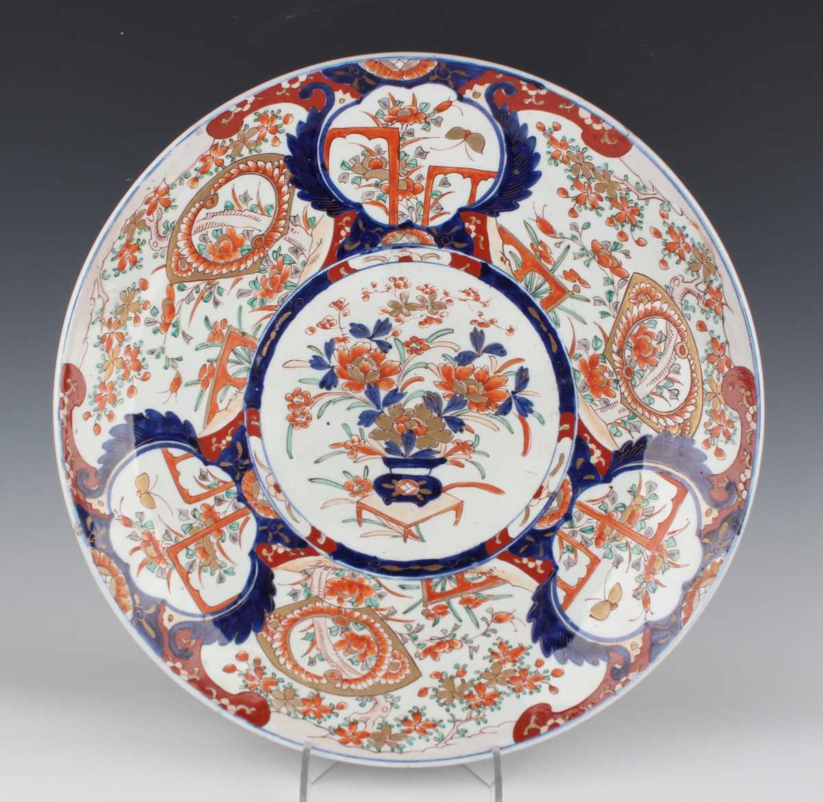 A Japanese Imari porcelain circular charger dish, Meiji period, typically painted and gilt with