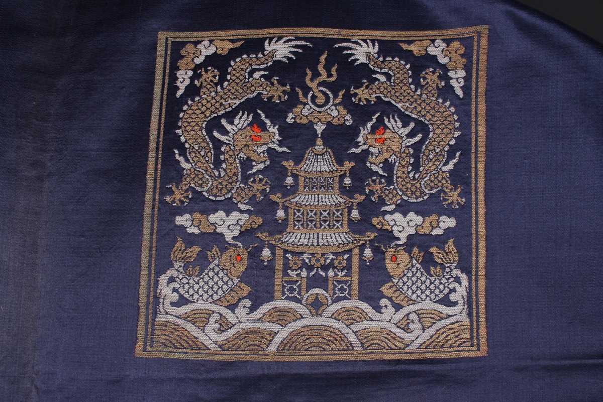 A Chinese blue silk embroidered rectangular panel, 20th century, worked with eight matching rank - Image 21 of 70