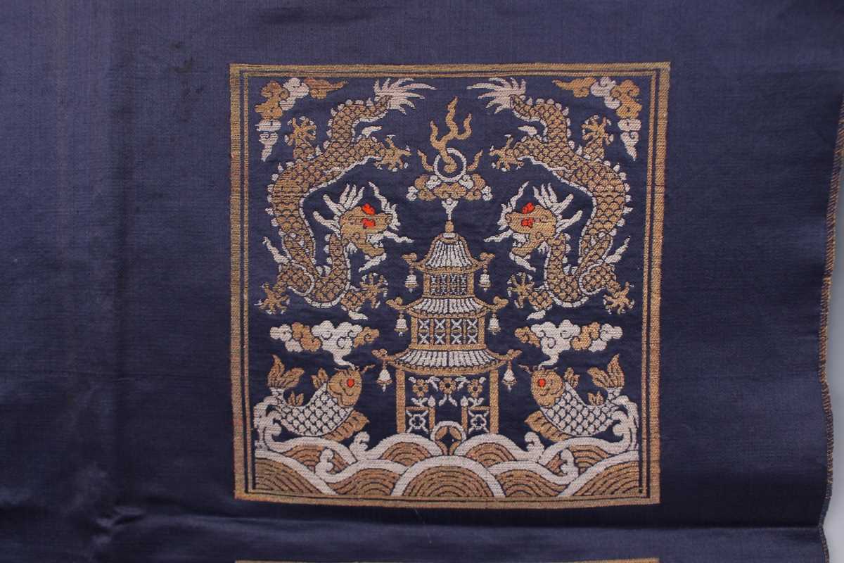 A Chinese blue silk embroidered rectangular panel, 20th century, worked with eight matching rank - Image 23 of 70