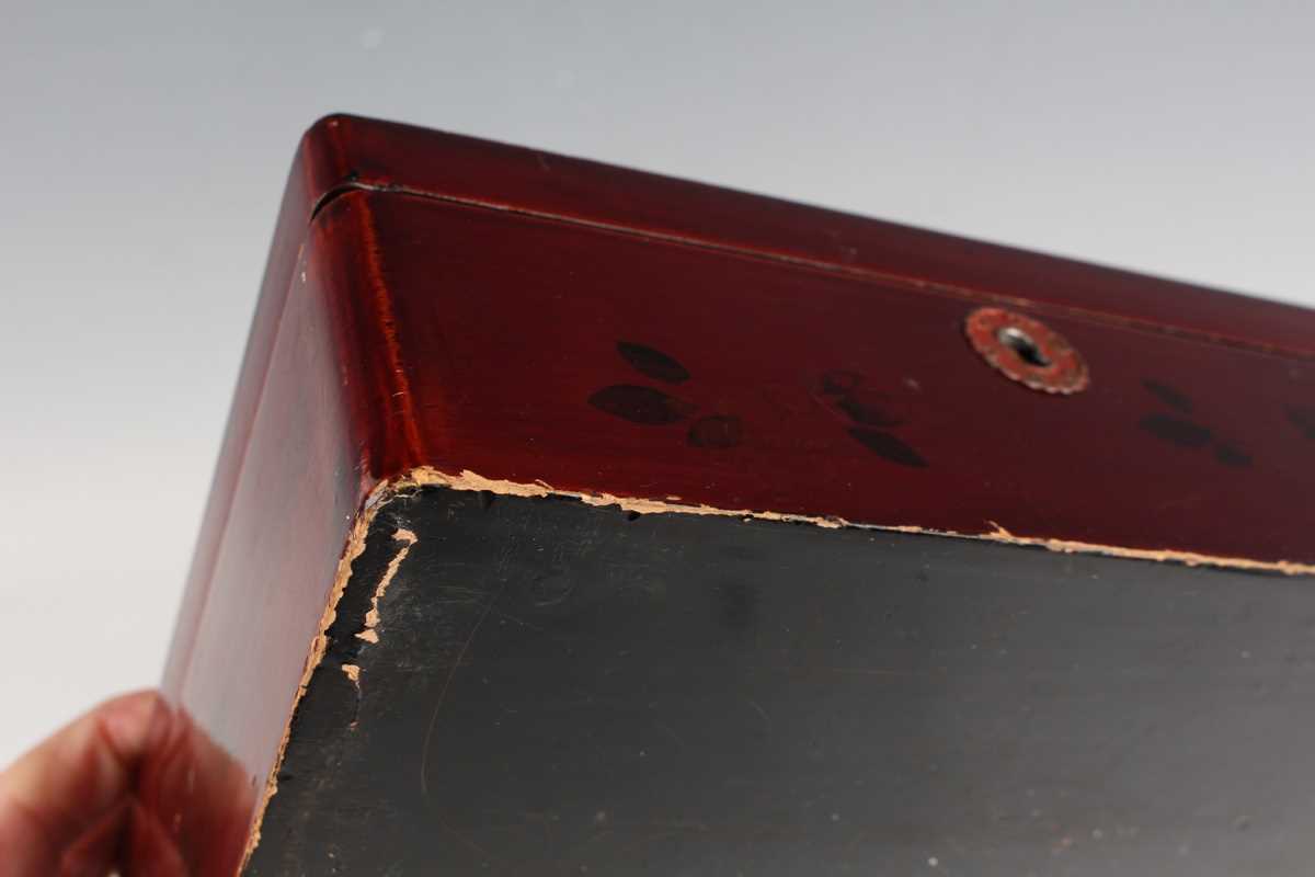 A Chinese red lacquer three-tier box with overhead handle, late 19th/early 20th century, decorated - Image 33 of 46
