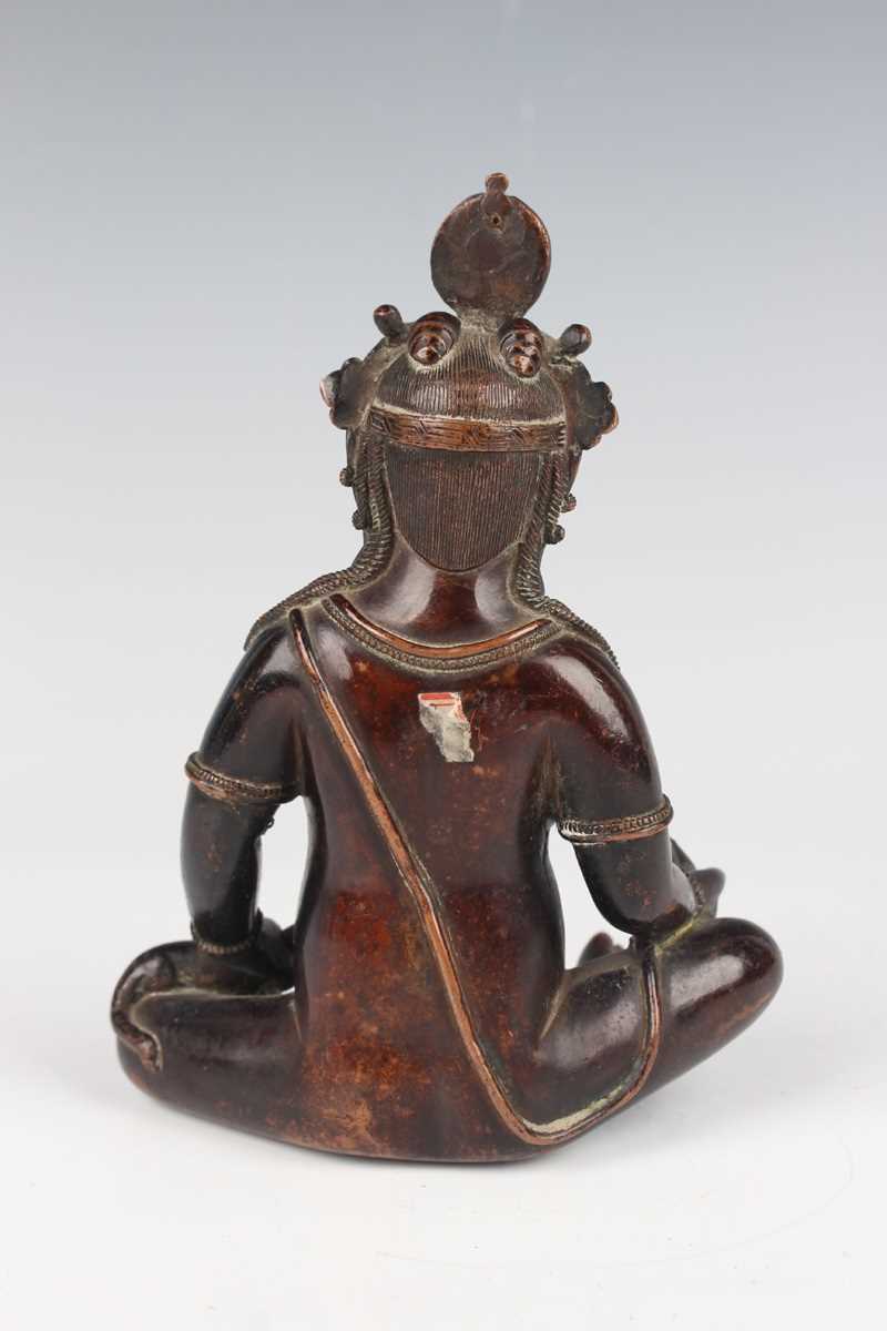 A Sino-Tibetan brown patinated copper alloy/bronze figure of Jambhala, late Qing dynasty, with - Image 6 of 8