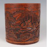 A Chinese bamboo brushpot, early 20th century, carved in relief with figures in landscape, height