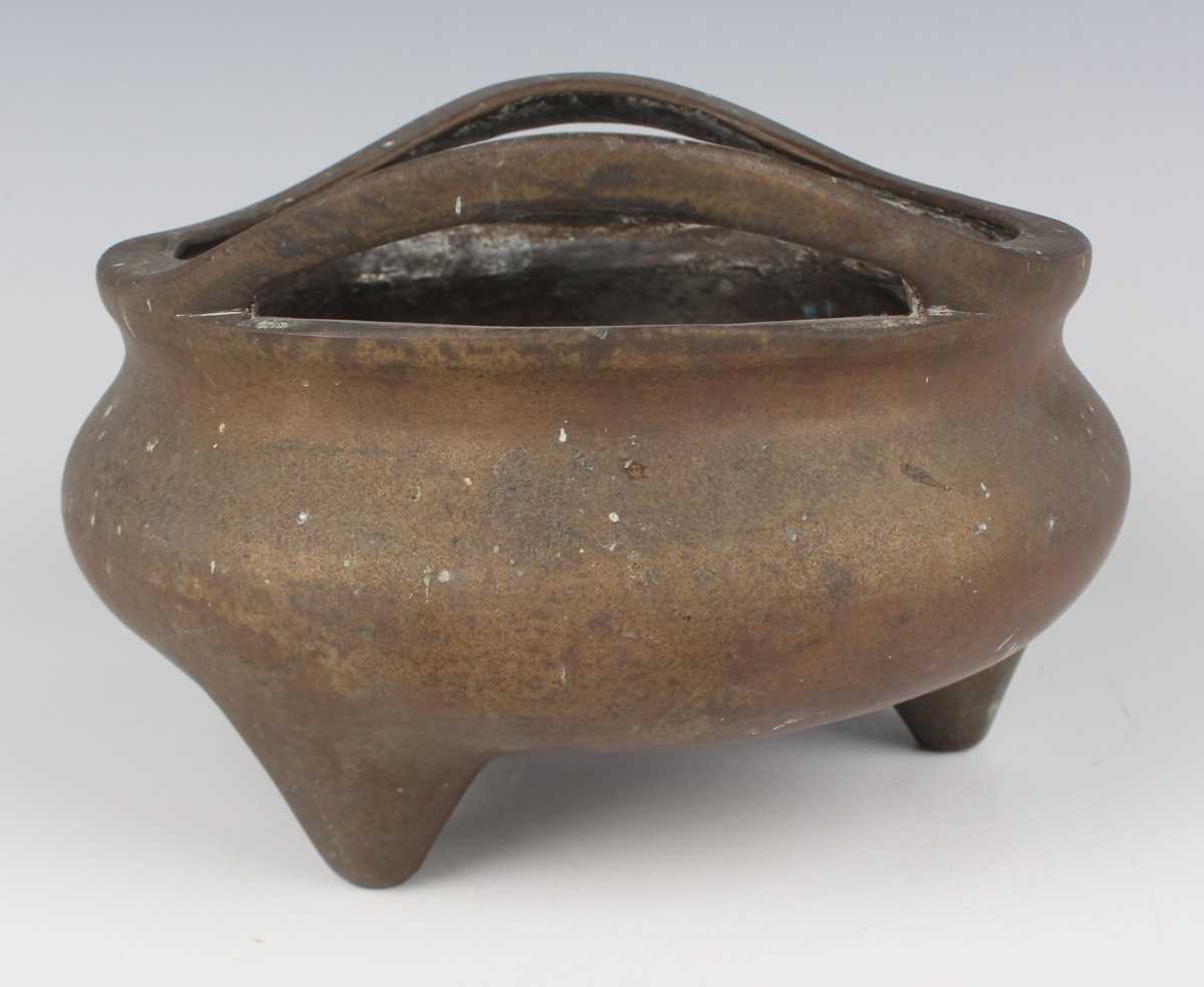 A Chinese bronze bombé censer, 19th/20th century, of low-bellied circular form with a pair of loop - Image 2 of 7