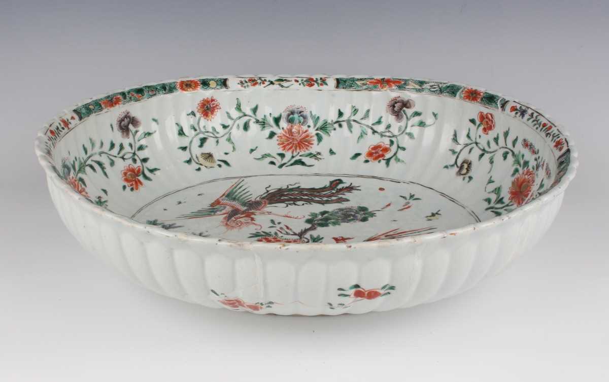 A Chinese famille verte export porcelain bowl, Kangxi period, of fluted oval form, the interior