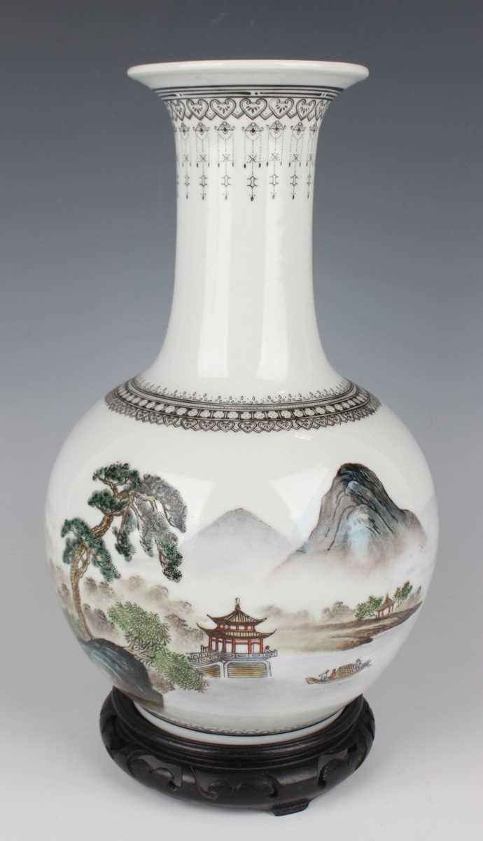 A Chinese porcelain bottle vase, Republic period or slightly later, the globular body painted with