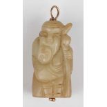 A Chinese hardstone pendant, late Qing dynasty, carved in the form of a bearded elder holding a