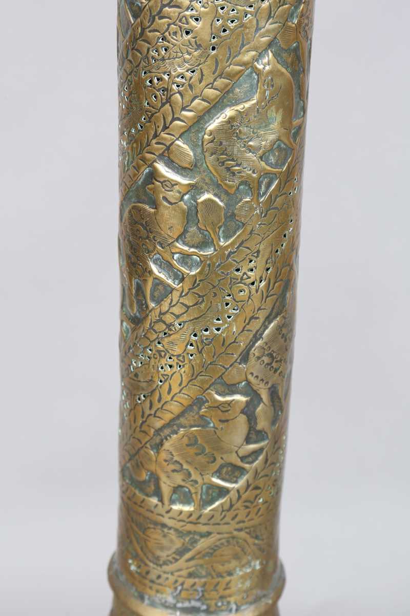 An Islamic brass floor lamp, circa 1900, the flared surmount and cylindrical column decorated with - Image 6 of 24