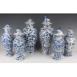 A group of six Chinese blue and white porcelain vases and covers, late 19th century, each of