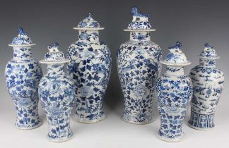 A group of six Chinese blue and white porcelain vases and covers, late 19th century, each of