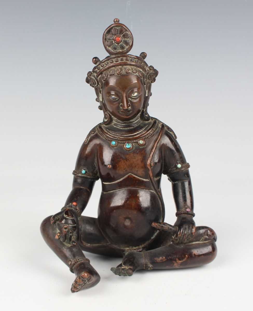 A Sino-Tibetan brown patinated copper alloy/bronze figure of Jambhala, late Qing dynasty, with