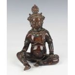 A Sino-Tibetan brown patinated copper alloy/bronze figure of Jambhala, late Qing dynasty, with
