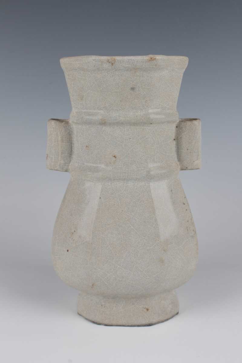 A Chinese Guan-type hu shaped vase, probably Qing dynasty, of octagonal baluster form with tubular - Image 3 of 7