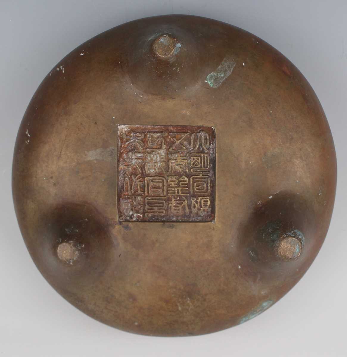 A Chinese bronze bombé censer, 19th/20th century, of low-bellied circular form with a pair of loop - Image 6 of 7