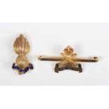A gold and enamelled military bar brooch, designed as the badge of the 222 Machine Gun Corps,