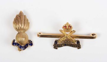 A gold and enamelled military bar brooch, designed as the badge of the 222 Machine Gun Corps,