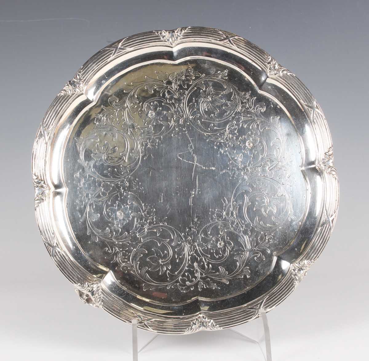 A Victorian silver circular salver, the centre engraved with scrolling stems of flowers and leaves